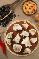 Foot raw pork on wooden background