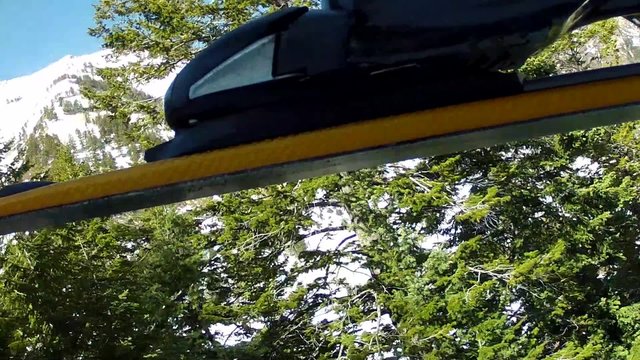 ski riding up ski lift
