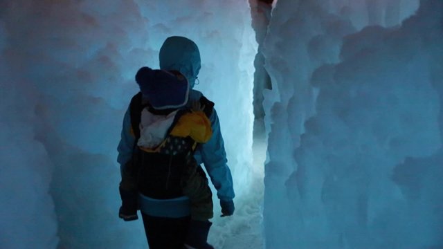 a mother and her baby in the ice castle