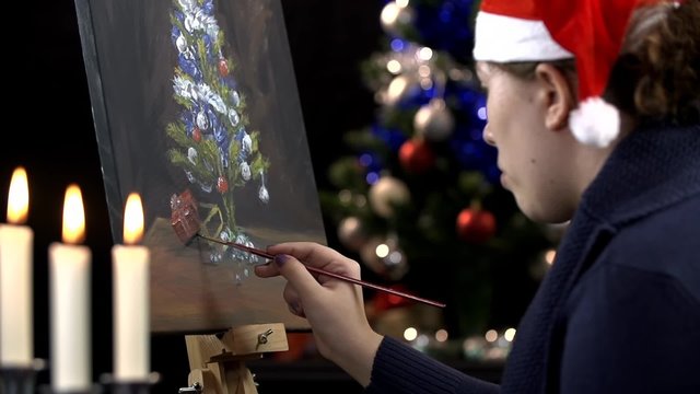 Artist drawing Christmas presents under tree