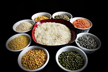 Different kinds of lentils with rise in bowls