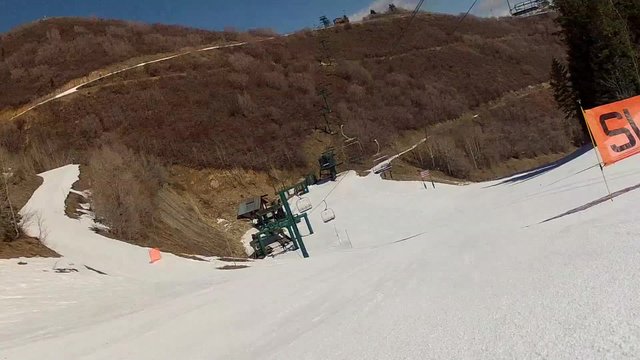 low shot of skiing down hill