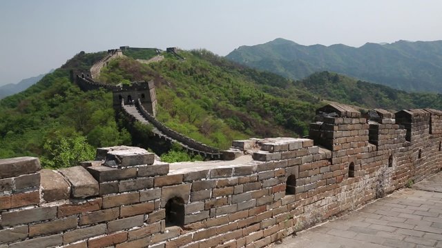 tourists hiking the beautiful section of great wall of china beijing mutianyu