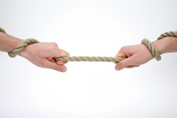  Two hands holding and pulling the rope 