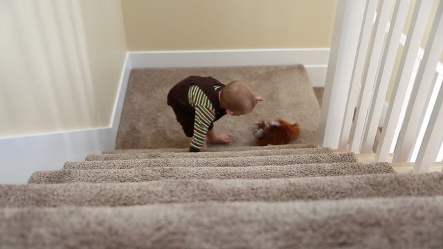 toddler playing on stairs