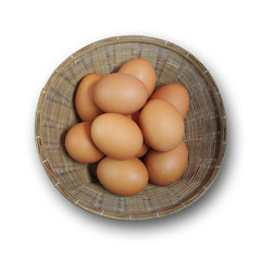 Fresh eggs in basket isolated on white background