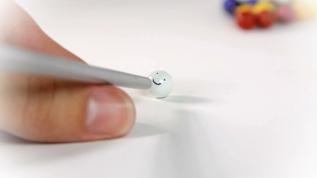 Hitting a smily face in pool table on white backround