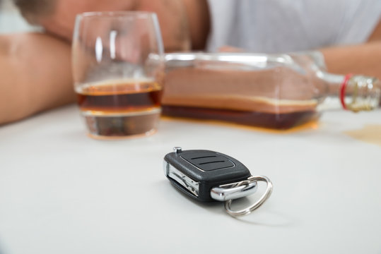 Man With Glass Of Liquor And Car Key