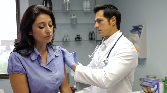Doctor Giving Female Patient Injection