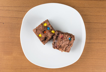 brownies in plate on wood table