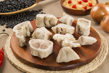 Foot raw pork on wooden background