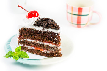 Chocolate cake delicious decorated with whipped cream and cherri