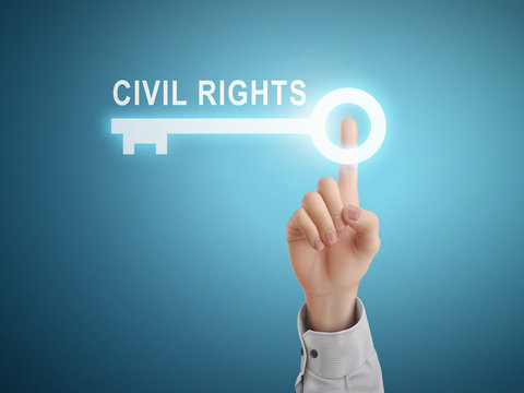 male hand pressing civil rights key button