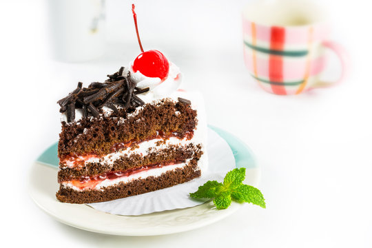 Chocolate cake delicious decorated with whipped cream and cherri