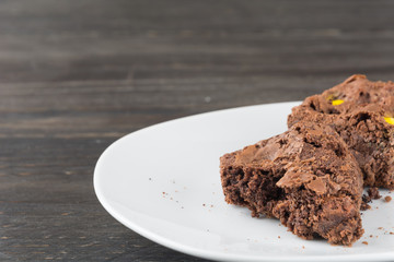 brownies in plate on wood table