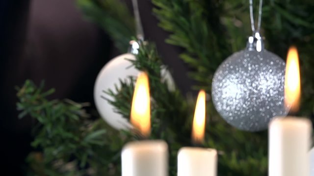 Candlestick to Christmas decoration refocus close up