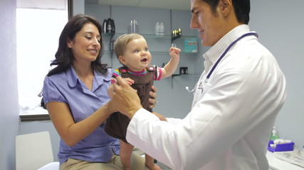 Mother And Baby Visiting Doctor's Office