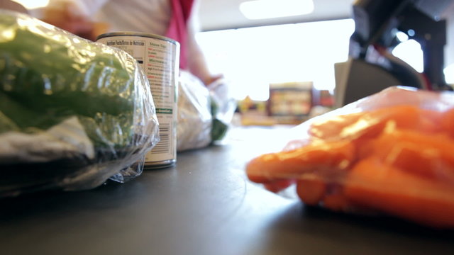 Time Lapse Sequence Of Supermarket Groceries Being Scanned
