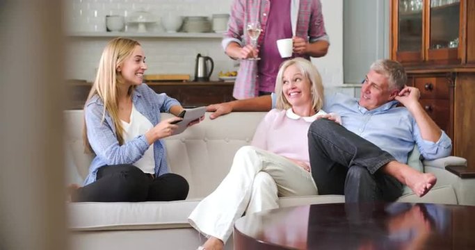 Parents With Adult Offspring Using Digital Devices At Home