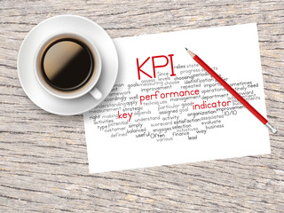 Coffee, Pencil And A Note Contain Word Clouds Of KPI 