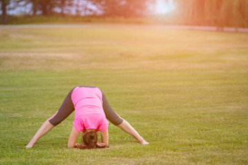 The image with a woman doing yoga in a park