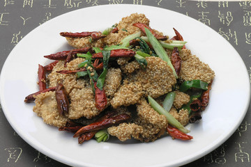Chicken nuggets with sesame seeds and pepper