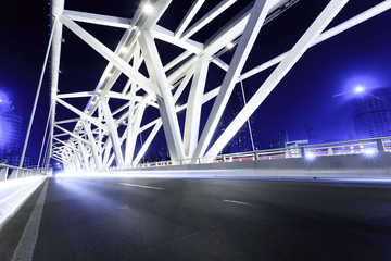 modern bridge with empty road floor at night