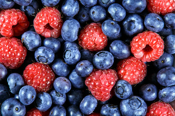 Clouse up Fresh Organic  Blueberries and Raspberries. Rich with vitamins Background, texture