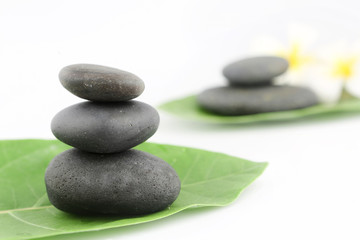 Obraz na płótnie Canvas Balanced black zen stones on white background 