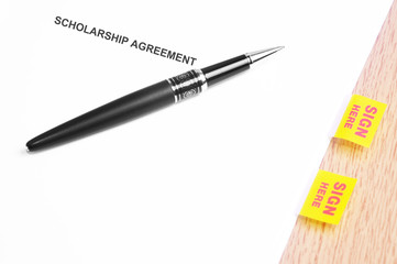 Black Pen And Scholarship Agreement With Sign Here Stickers