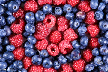 Clouse up Fresh Organic  Blueberries and Raspberries. Rich with vitamins Background, texture
