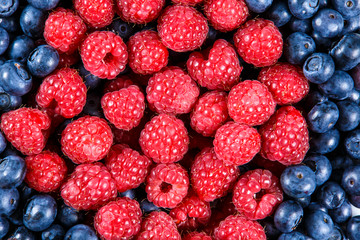 Clouse up Fresh Organic  Blueberries and Raspberries. Rich with vitamins Background, texture