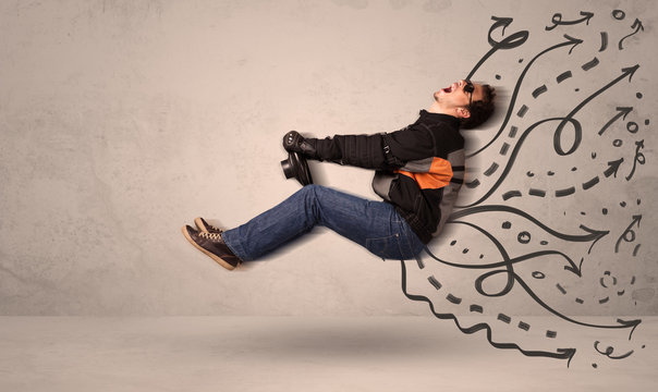 Funny man driving a flying vehicle with hand drawn lines after h