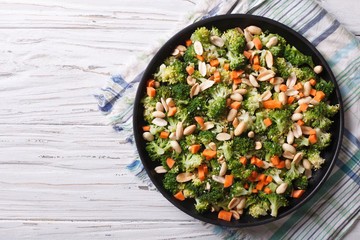 Summer salad with broccoli and peanuts closeup horizontal top view
