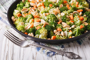 Summer salad with broccoli, carrots and peanuts horizontal
