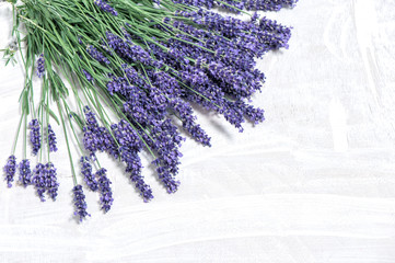 Lavender flowers over rustic wooden background