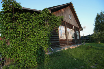 Fototapeta na wymiar Country house in the village wilderness