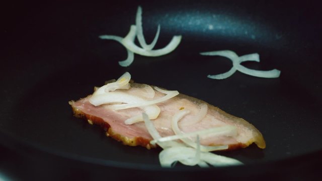 Bacon frying in a pan