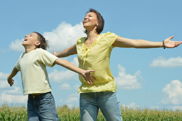 Family walking in field