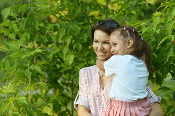 Little  girl with  mother in  park