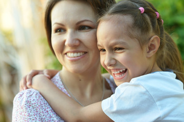 Little  girl with  mother in  park