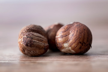 macro hazelnuts on wooden table