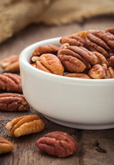 Pecan nuts in white bowl