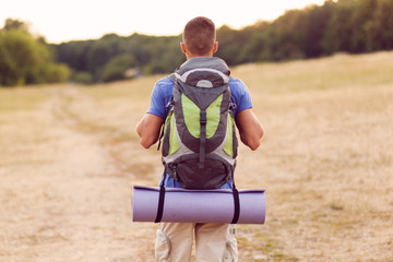 Fototapeta premium Young tourist hiking alone
