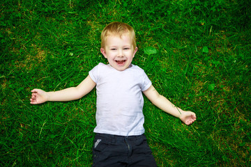 Portrait of a happy little boy in the park