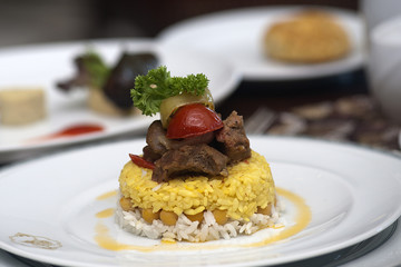 pieces of meat and saffron pilaff 

 