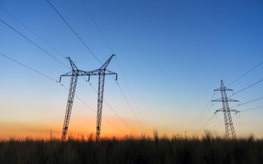 Large transmission towers at blue hour 