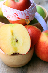 measure tape and apple