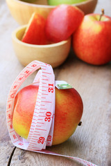 measure tape and apple