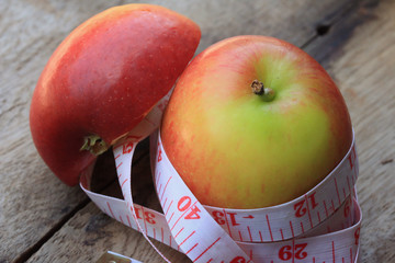 measure tape and apple